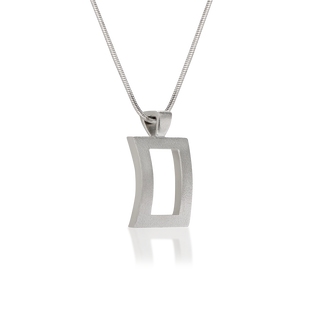 Side view of Satin Edge pendant necklace, tarnish-resistant 925 silver fine jewellery, concave rectangle with rectangular cutout, velvety satin finish, sterling silver snake chain, Midnight Coast.